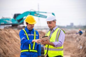 manager and safety auditor reviewing a safety inspection checklist
