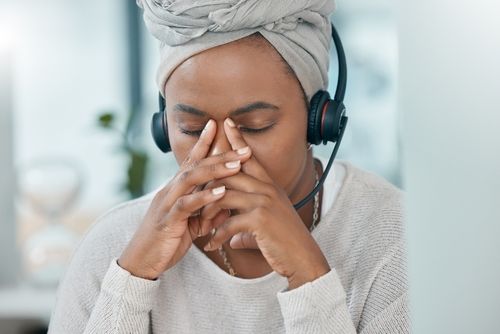 Black,Woman,Stress,,Call,Center,Consultant,In,Office,Closeup,While - Workplace Mental Health