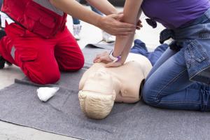 CPR being taught in first aid training session