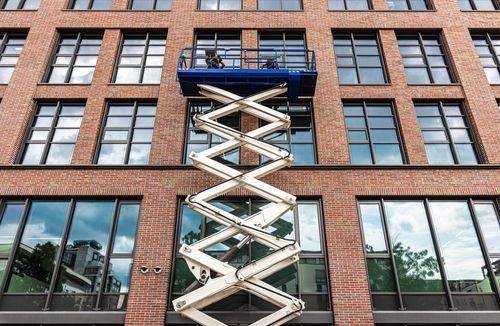 Maintenance,Workers,Are,Repairing,A,Modern,Building,Facade,From,An - Aerial Platform Safety