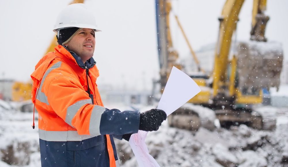 workers at construction site in winter
