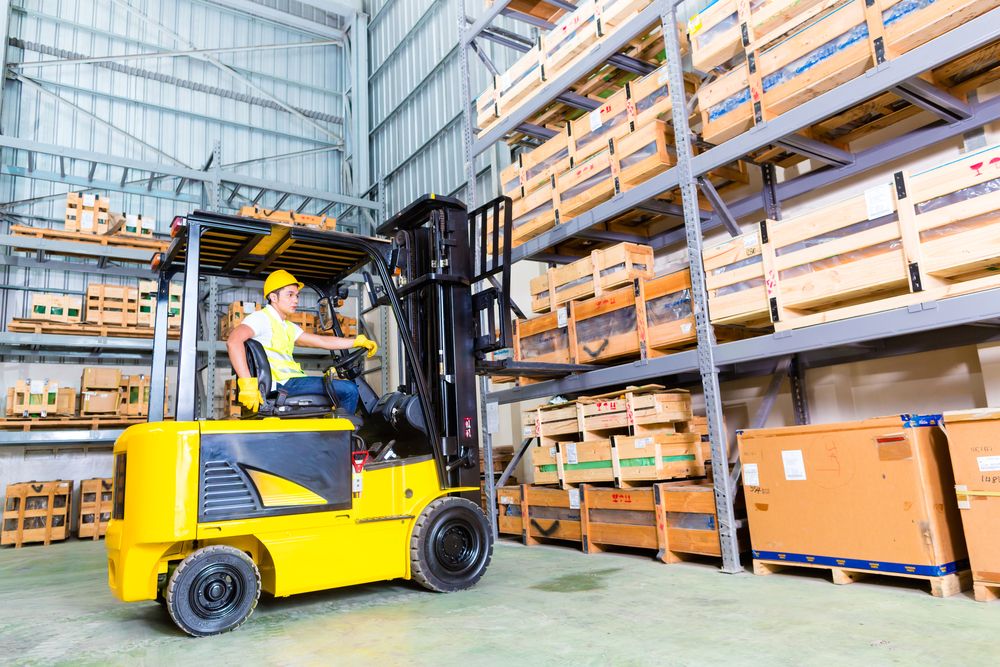 certified forklift operating safely using a forklift