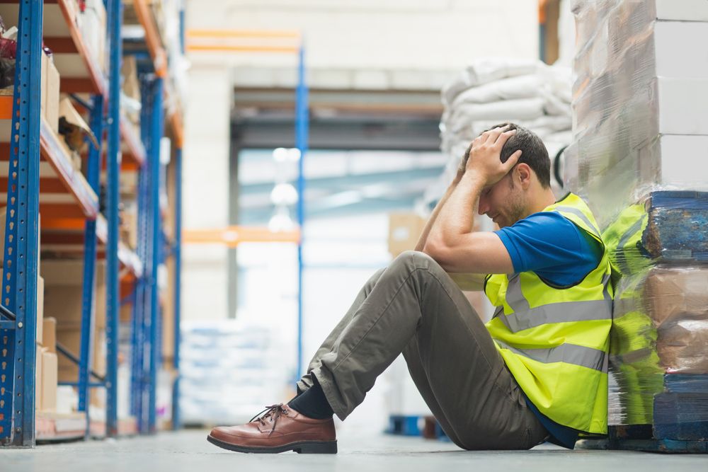 a warehouse worker on the verge of burnout due to poor mental health