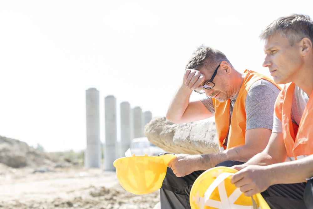 tired construction workers