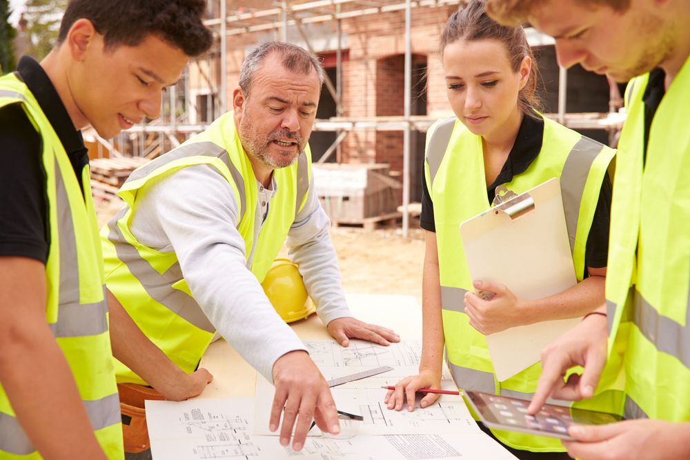 lead engineer providing safety training to new employees at the workplace