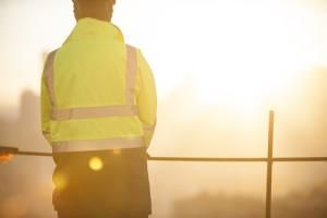 worker in yellow safety vest at job site