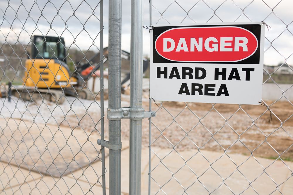 safety signage that reminds people that heard hats a re required in the work area