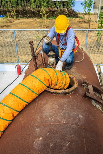 worker entering confined space