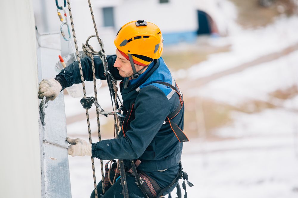 man working at heights with restraints