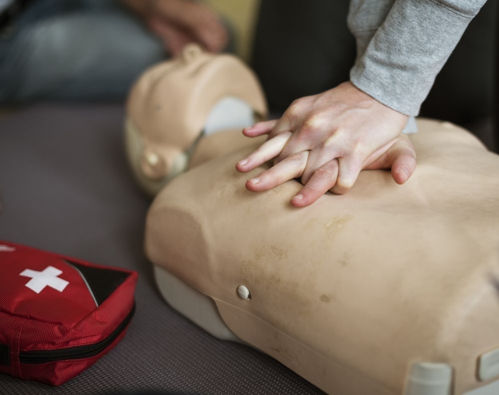 first aid training class using a model