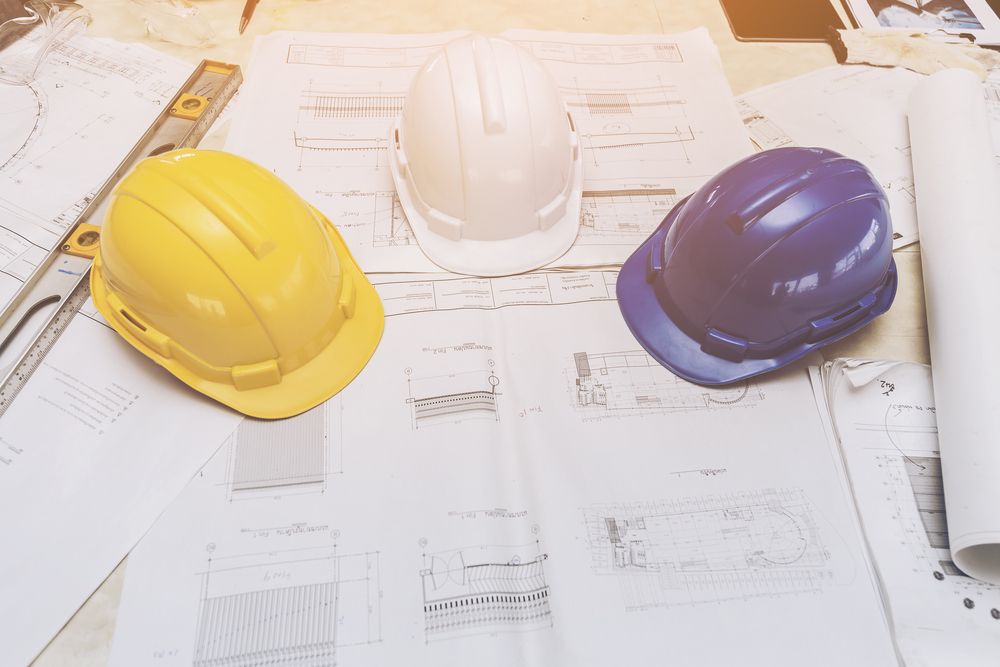 hard hats and blueprints