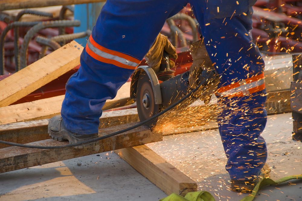 worker operates saw in workplace