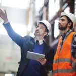 supervisor in workplace talking to staff