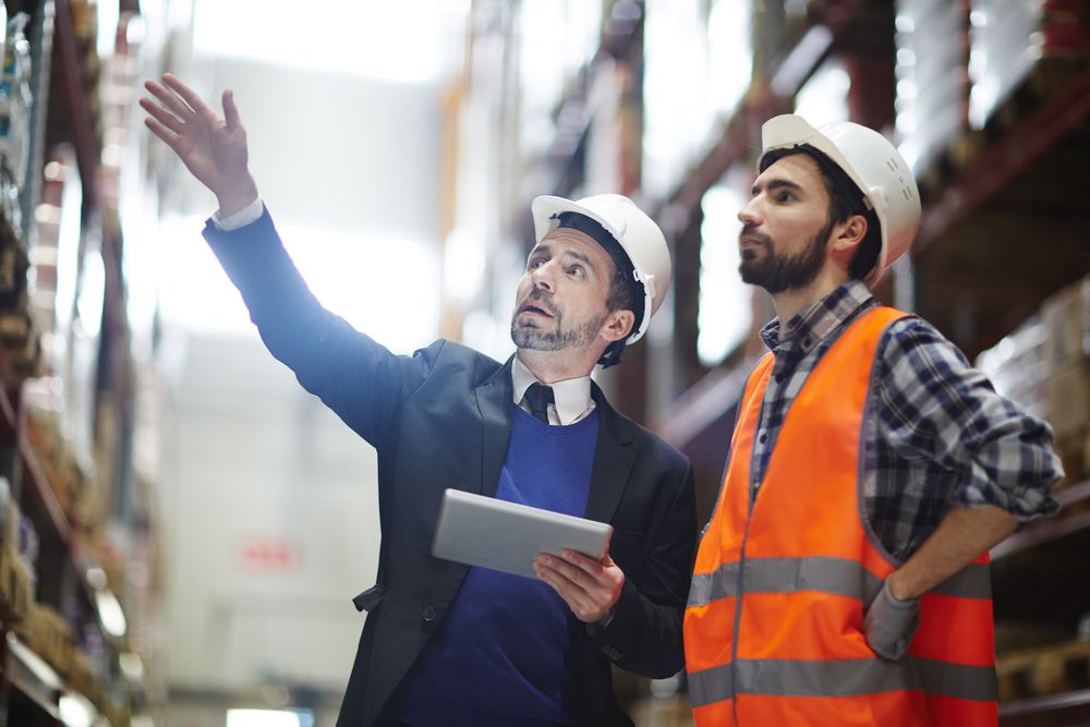 supervisor in workplace talking to staff