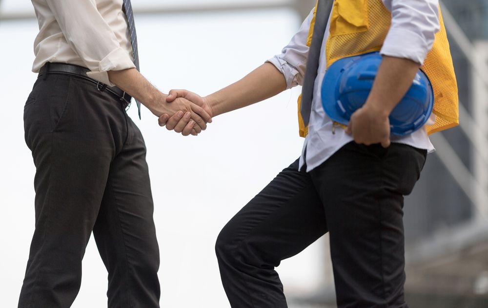 shaking hands with workplace safety consultant
