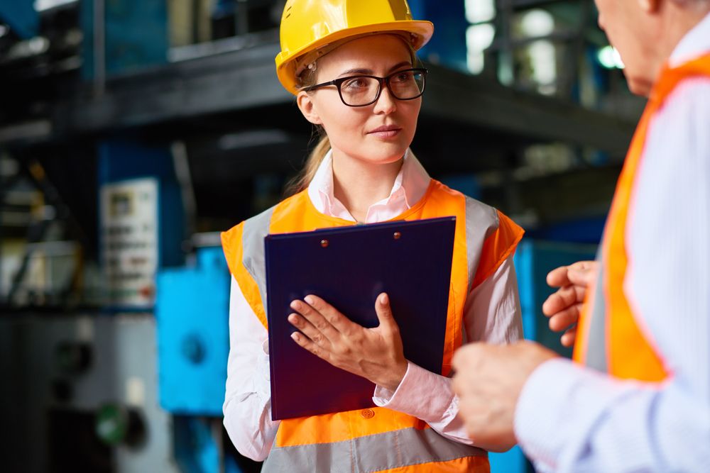 workplace safety inspector meets with supervisors
