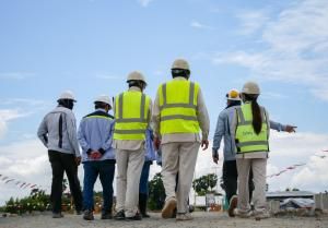 management and site workers assess safety risks