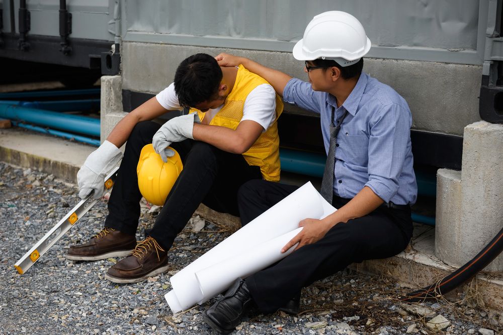 a manager trying to create a safe workplace talking to a worker who is suffering from poor mental health