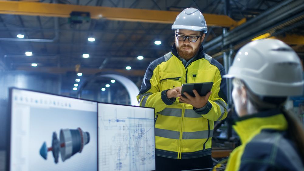 worker in PPE at work site doing due diligence