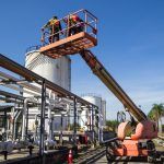 Two workers on a boom lift