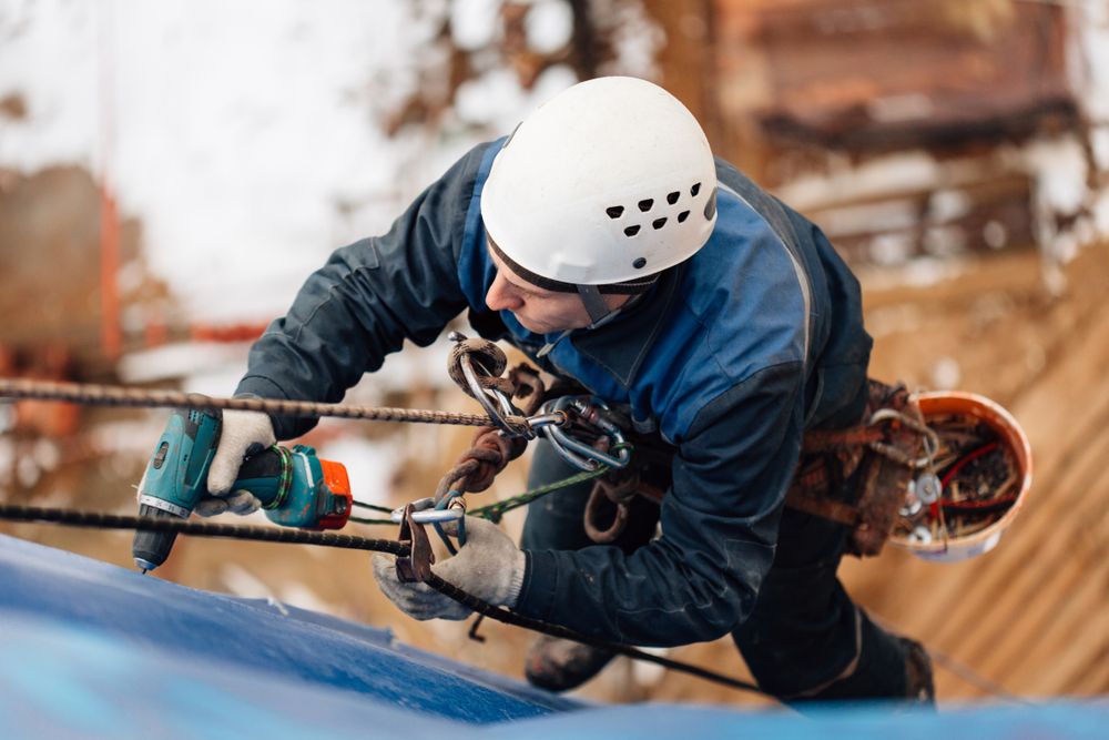 man working at heights with restraints