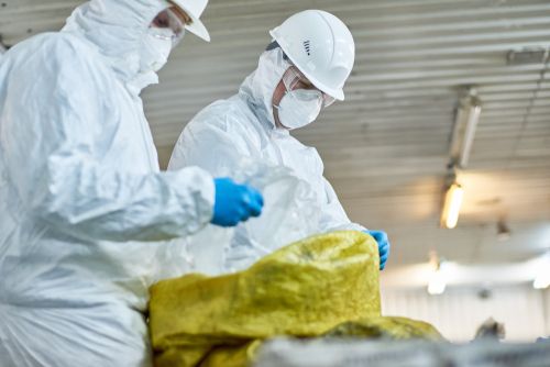 workers in protective gear working