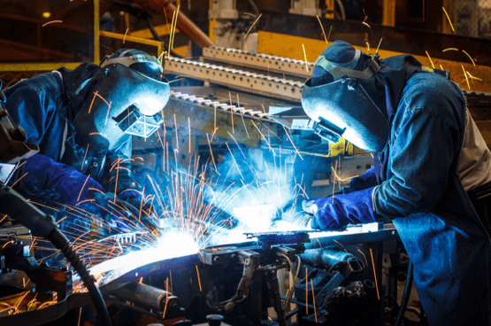 welding workers in a shop