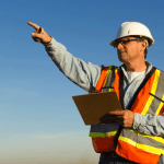 health and safety inspector pointing out a workplace hazard