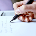 pen writing on paper