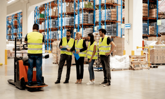 Warehouse workers participate in forklift training