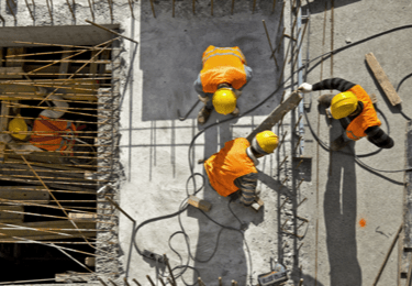 construction workers in safety vests and hard hats
