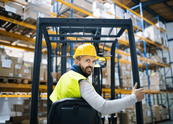 man driving a forklift