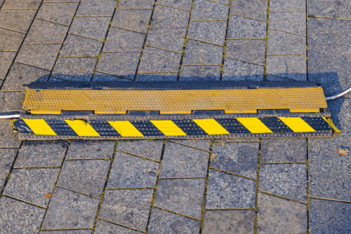 a floor cord cover keeping cables secure. 